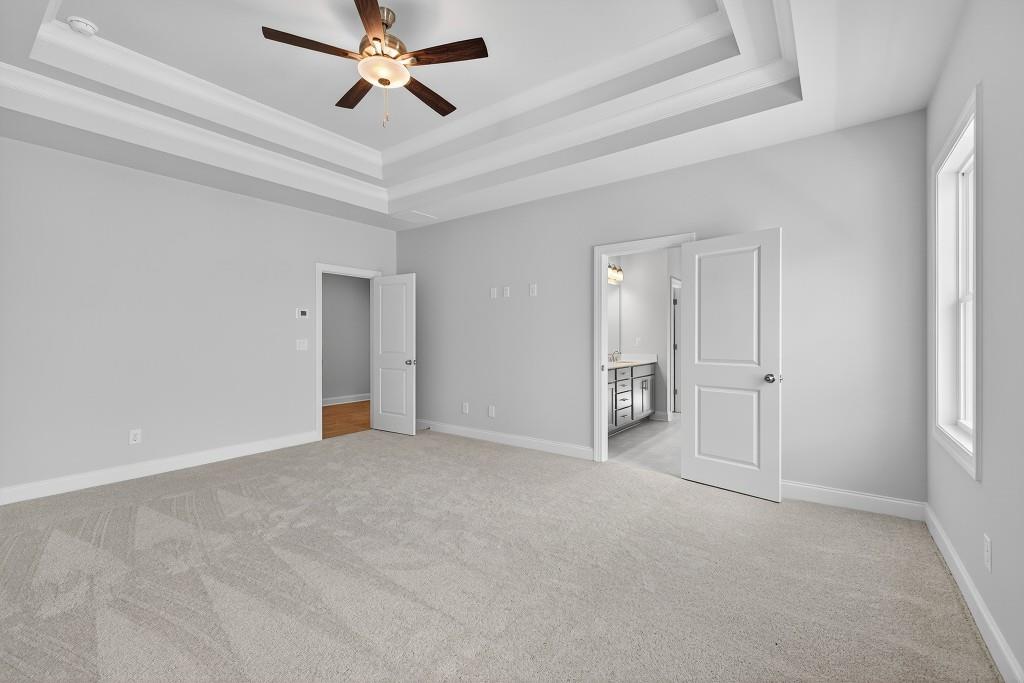 5566 Spring Street Flowery Branch, GA 30542 - Photo 32 of 66 a view of empty room with a ceiling fan