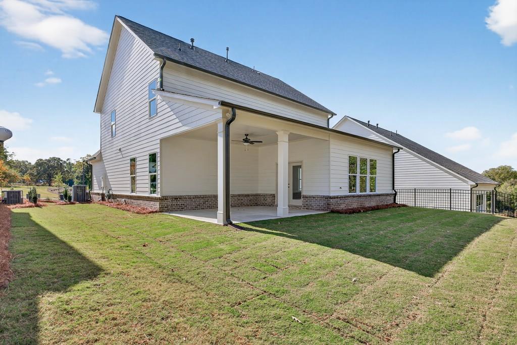 5566 Spring Street Flowery Branch, GA 30542 - Photo 39 of 66 a view of a backyard with plants and a backyard