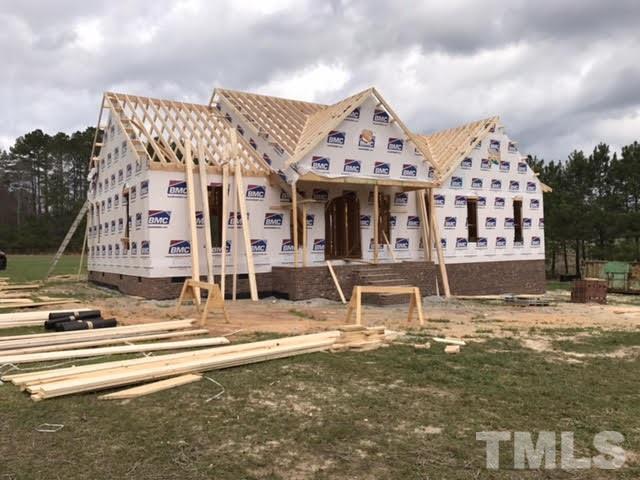 2209 Pearces Road Zebulon, NC 27597 - Photo 1 of 4 a large building with a view of the front of it