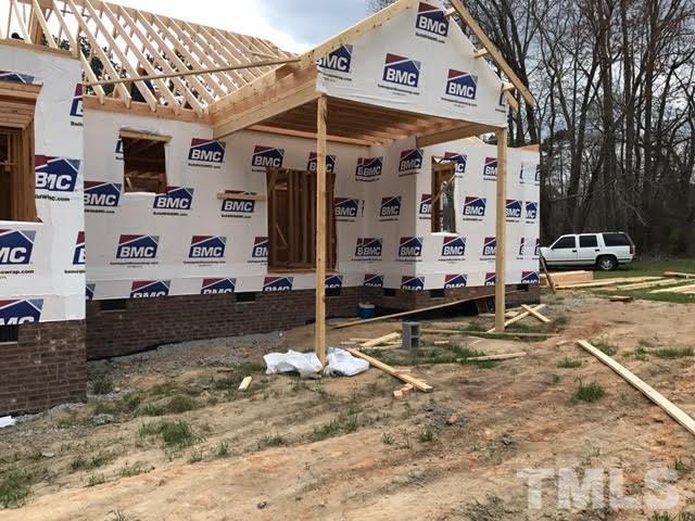 2209 Pearces Road Zebulon, NC 27597 - Photo 2 of 4 a view of a large white building
