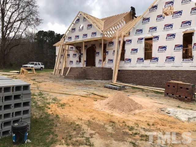 2209 Pearces Road Zebulon, NC 27597 - Photo 3 of 4 a view of the front of house with a street