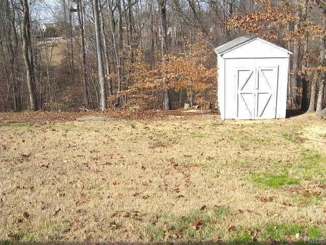 3132 Eric Street Willow Spring, NC 27592 - Photo 12 of 12 Private back yard with storage shed