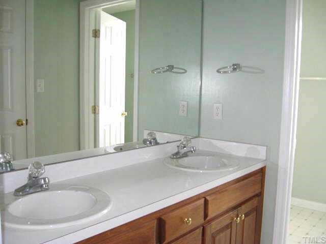 Lovely master bath with dual vanity areas & separate room for tub/shower/toilet