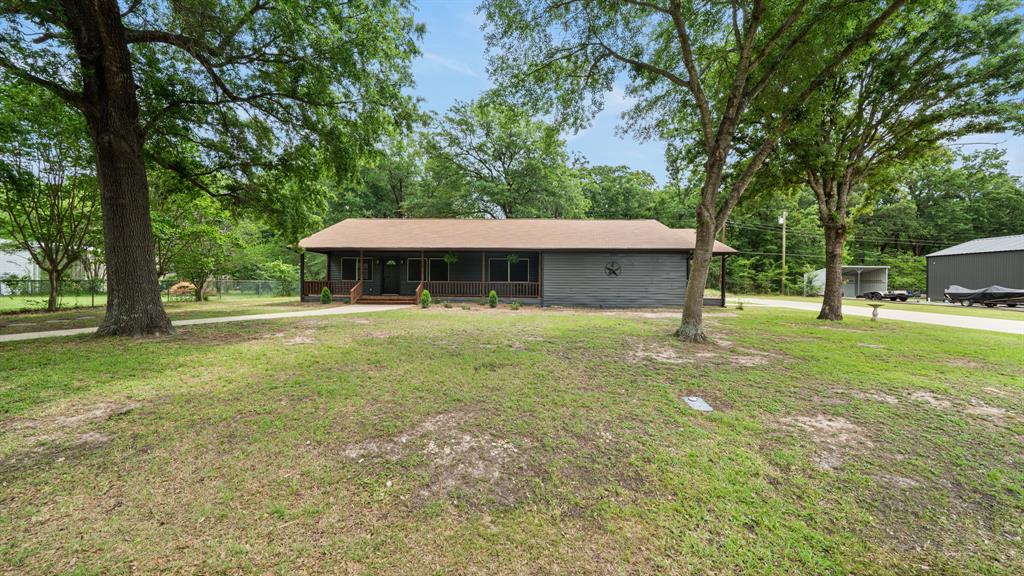 129 King Arthur Road Mabank, TX 75156 - Photo 3 of 33 a front view of a house with a yard
