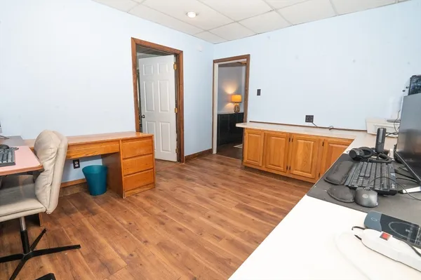 a bedroom with furniture and wooden floor