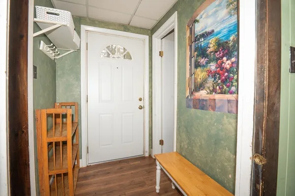 an entryway with wooden floor