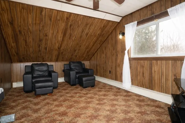 a view of a couches in the room and window