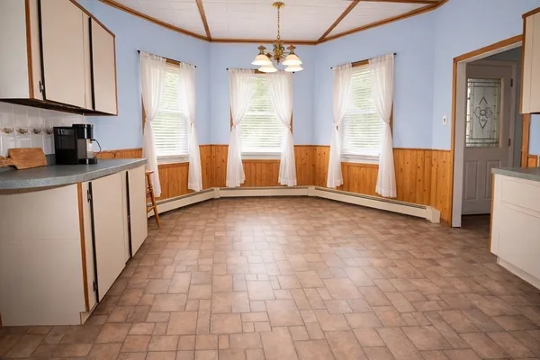 a view of a kitchen with a sink and dishwasher cabinets