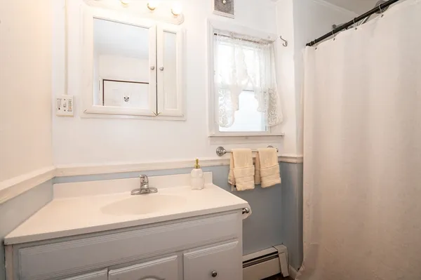 a bathroom with a sink and a mirror