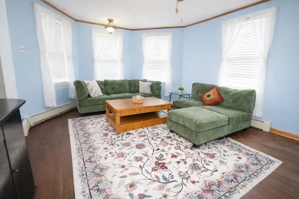 a living room with furniture and a rug