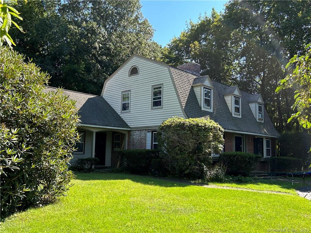 101 Buttonball Road Orange, CT 06477 - Photo 1 of 1 a front view of a house with a yard