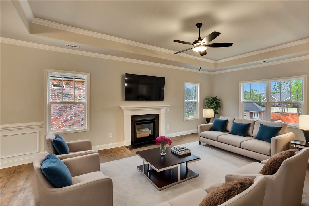118 Bonaire Point Anderson, SC 29621 - Photo 8 of 23 This inviting living room features a cozy fireplace and abundant natural light.