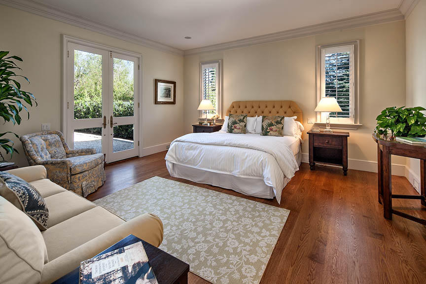 511 Las Fuentes Drive Santa Barbara, CA 93108 - Photo 4 of 11 a bedroom with a bed and wooden floor