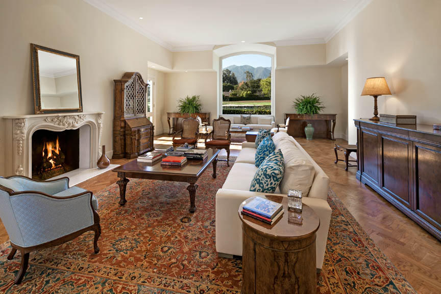 511 Las Fuentes Drive Santa Barbara, CA 93108 - Photo 8 of 11 a living room with furniture a fireplace and a large window
