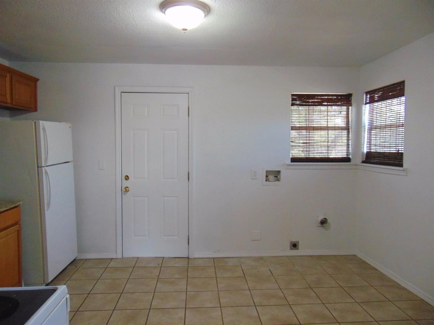 3223 Colgate Street Lubbock, TX 79415 - Photo 5 of 10 Front House-Kitchen Laundry