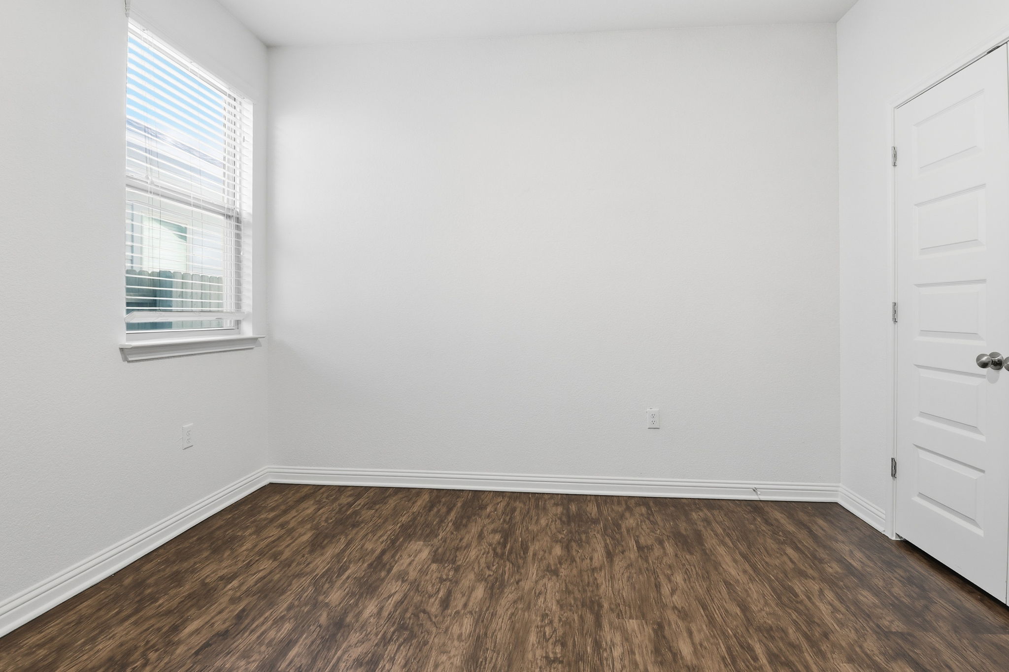 5908 Gerard Drive Austin, TX 78744 - Photo 21 of 34 Spare room featuring dark wood-style flooring