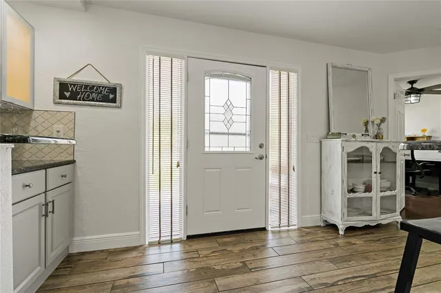 a kitchen with stainless steel appliances granite countertop a stove and a sink