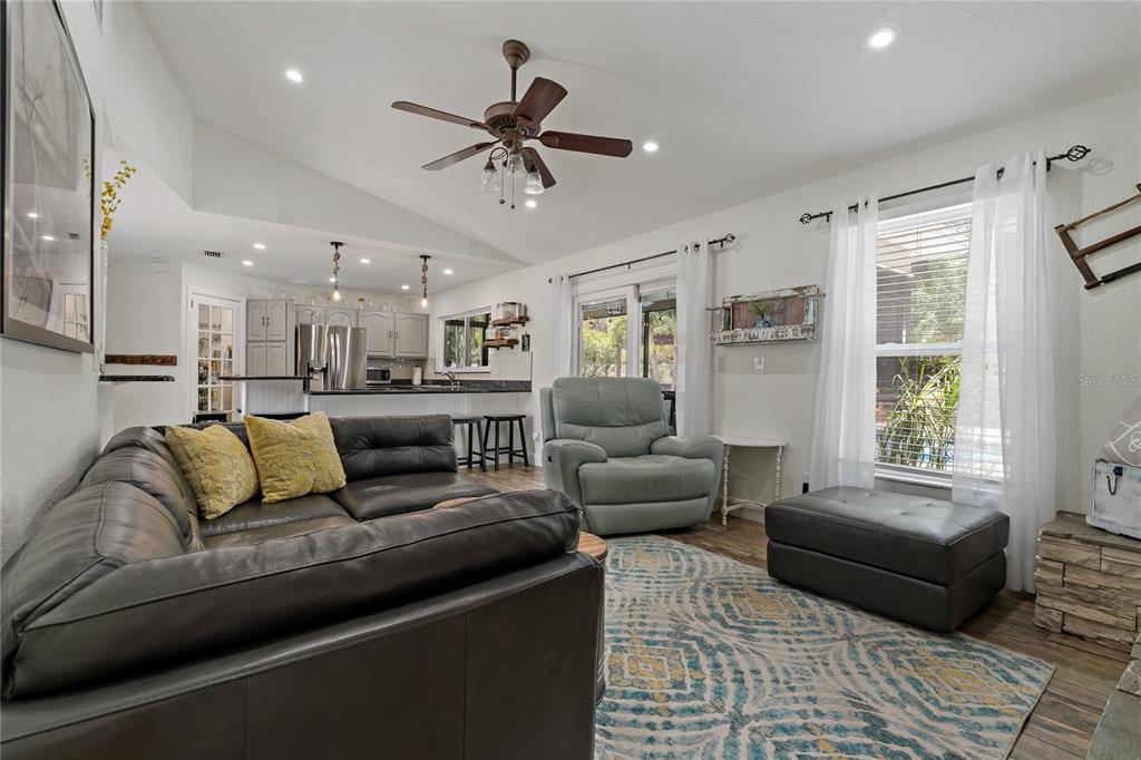 808 Rustic Oaks Drive Palm Harbor, FL 34684 - Photo 18 of 55 a living room with furniture and windows