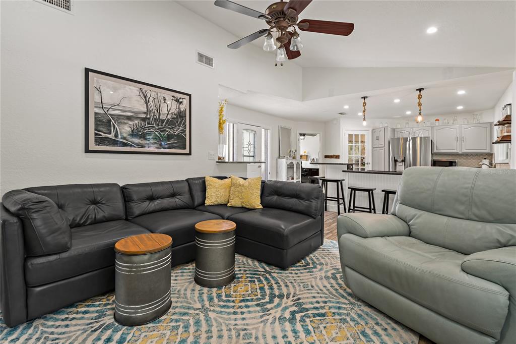 808 Rustic Oaks Drive Palm Harbor, FL 34684 - Photo 19 of 55 a living room with furniture and a view of kitchen