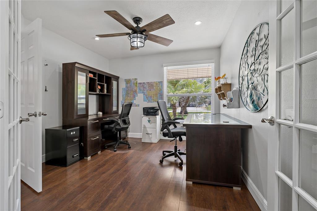 808 Rustic Oaks Drive Palm Harbor, FL 34684 - Photo 20 of 55 a view of a livingroom with workspace and a window