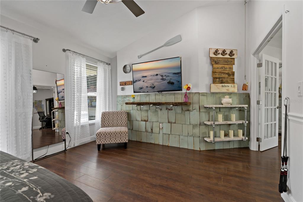 808 Rustic Oaks Drive Palm Harbor, FL 34684 - Photo 24 of 55 a living room with furniture and a flat screen tv