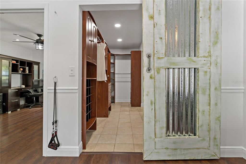 808 Rustic Oaks Drive Palm Harbor, FL 34684 - Photo 26 of 55 a view of a hallway with wooden floor and staircase