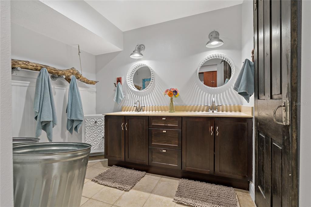 808 Rustic Oaks Drive Palm Harbor, FL 34684 - Photo 27 of 55 a bathroom with a sink and a mirror