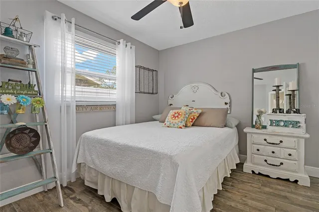 a bedroom with a bed and a dresser