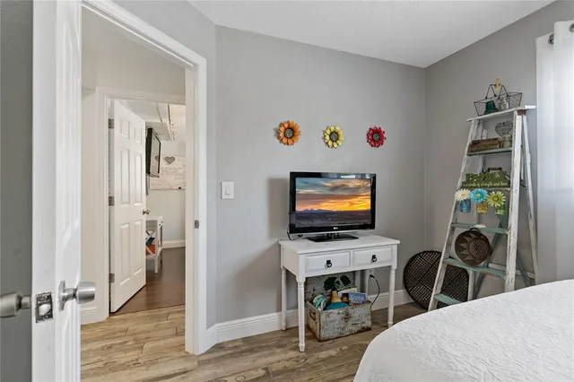 a bedroom with a bed and dresser