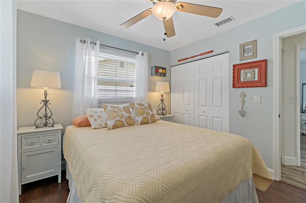 808 Rustic Oaks Drive Palm Harbor, FL 34684 - Photo 36 of 55 a bedroom with a bed and a cabinets