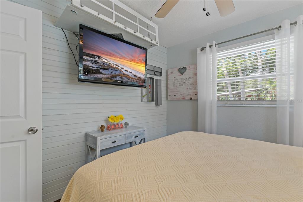 808 Rustic Oaks Drive Palm Harbor, FL 34684 - Photo 37 of 55 a bedroom with a bed and dresser