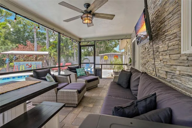 a view of a patio with table and chairs and potted plants