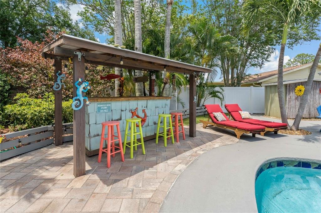 808 Rustic Oaks Drive Palm Harbor, FL 34684 - Photo 55 of 55 an outdoor space with seating