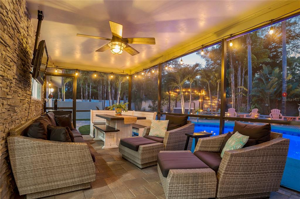 808 Rustic Oaks Drive Palm Harbor, FL 34684 - Photo 6 of 55 a outdoor living space with patio furniture and a potted plants