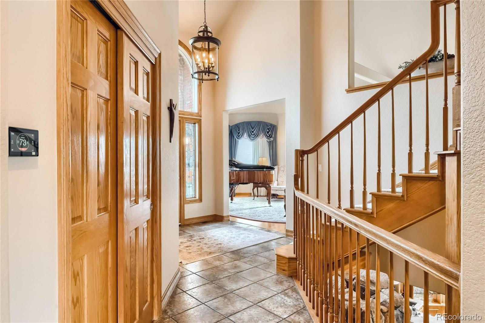 3935 Pierson Street Wheat Ridge, CO 80033 - Photo 13 of 40 a view of an entryway with staircase