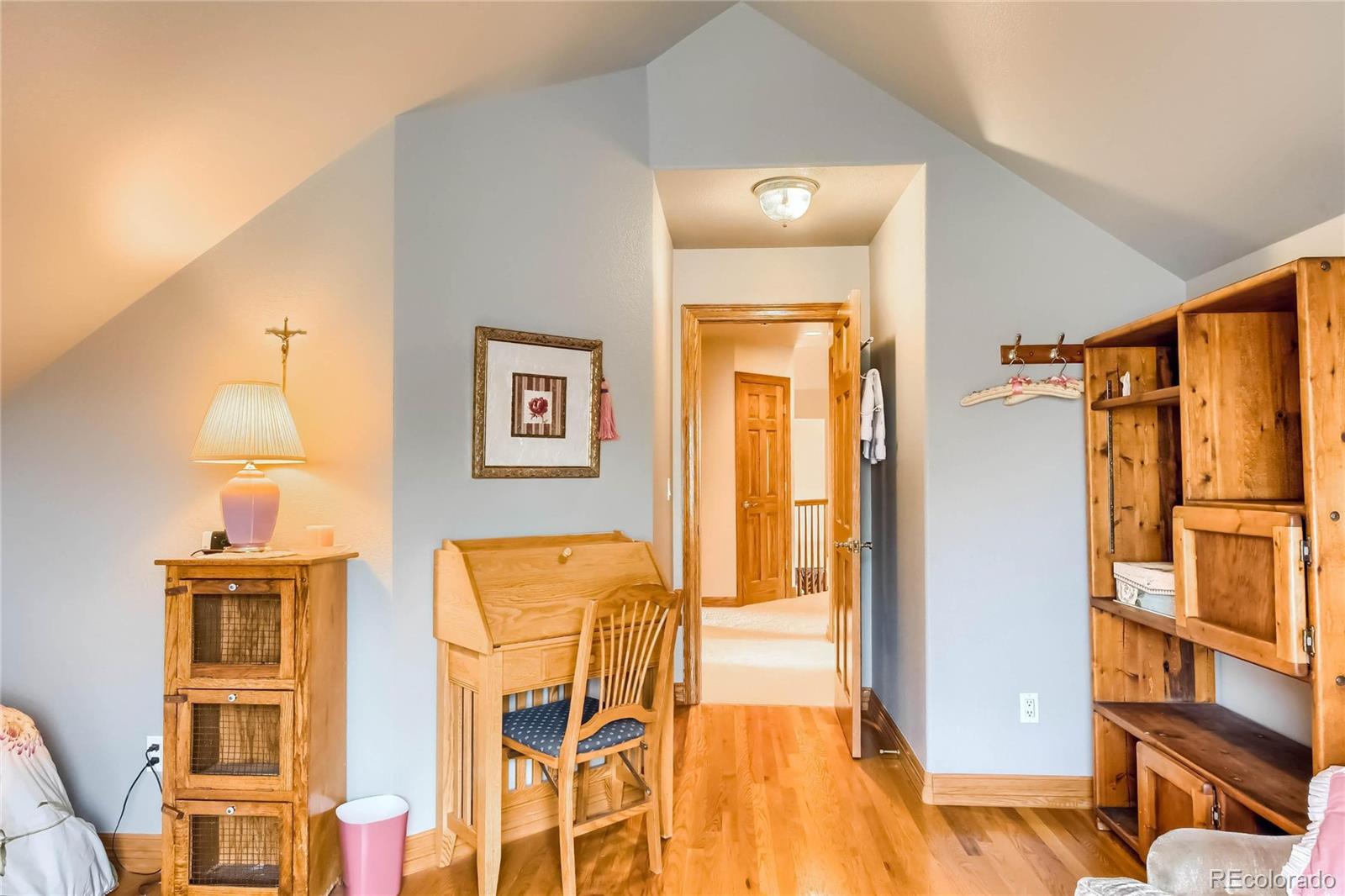 3935 Pierson Street Wheat Ridge, CO 80033 - Photo 21 of 40 a view of living room with furniture and wooden floor