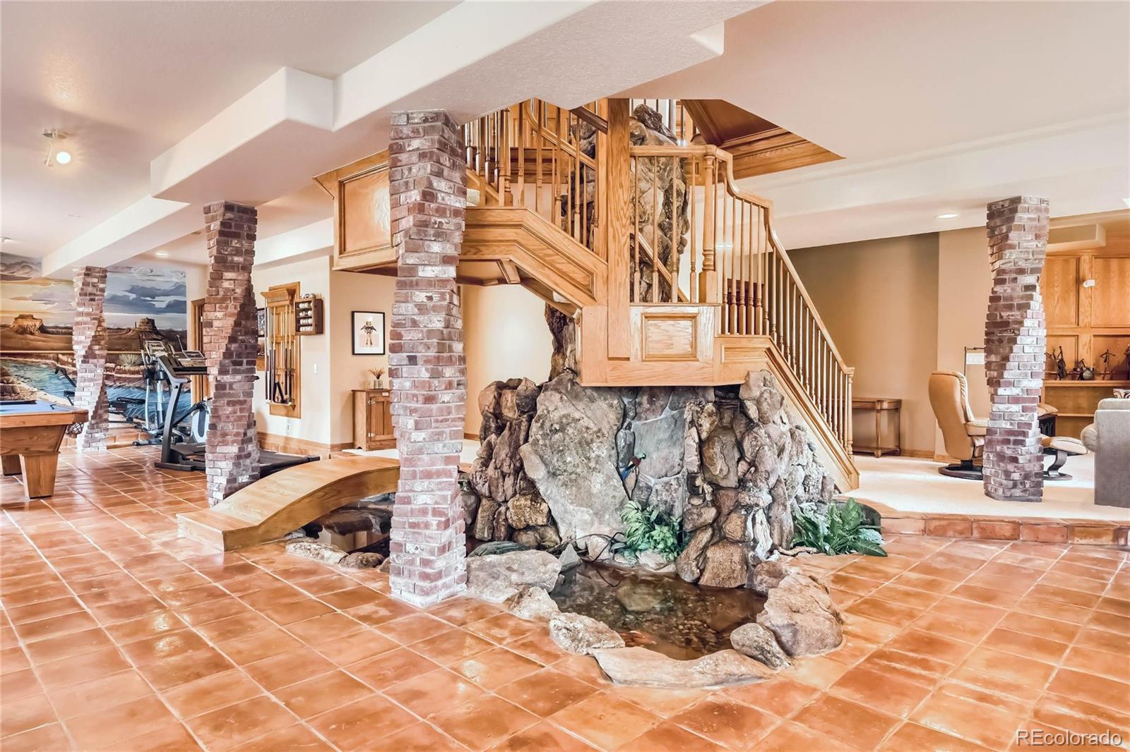 3935 Pierson Street Wheat Ridge, CO 80033 - Photo 22 of 40 a building with glass top table and chairs