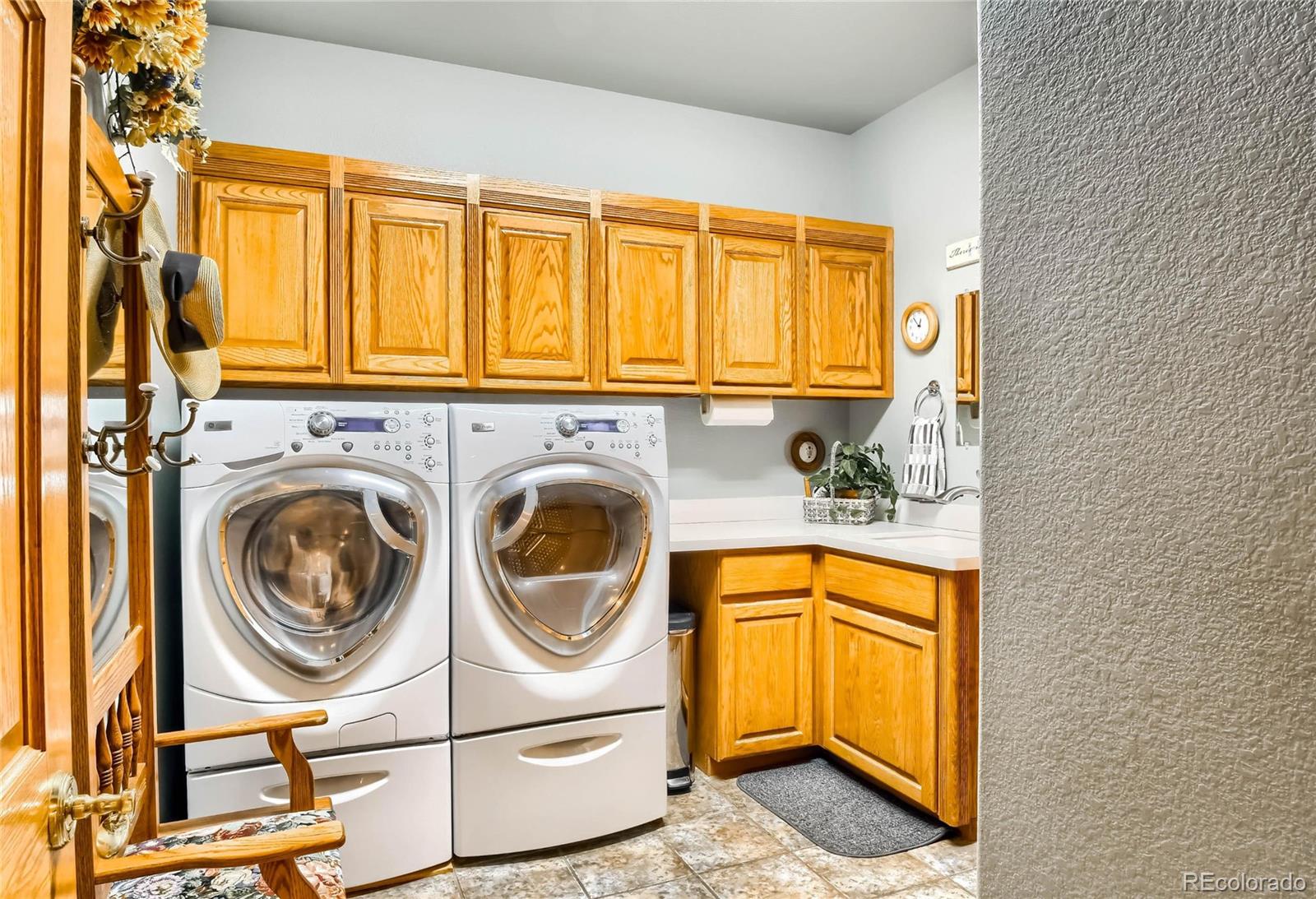 3935 Pierson Street Wheat Ridge, CO 80033 - Photo 28 of 40 a utility room with sink dryer and washer