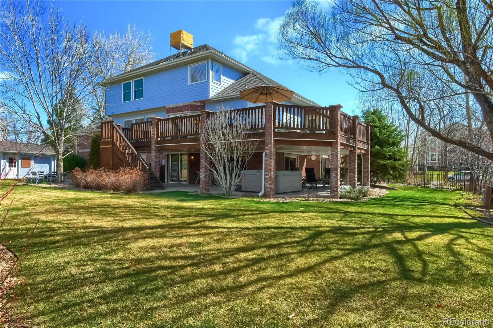 3935 Pierson Street Wheat Ridge, CO 80033 - Photo 33 of 40 a front view of a house with a garden