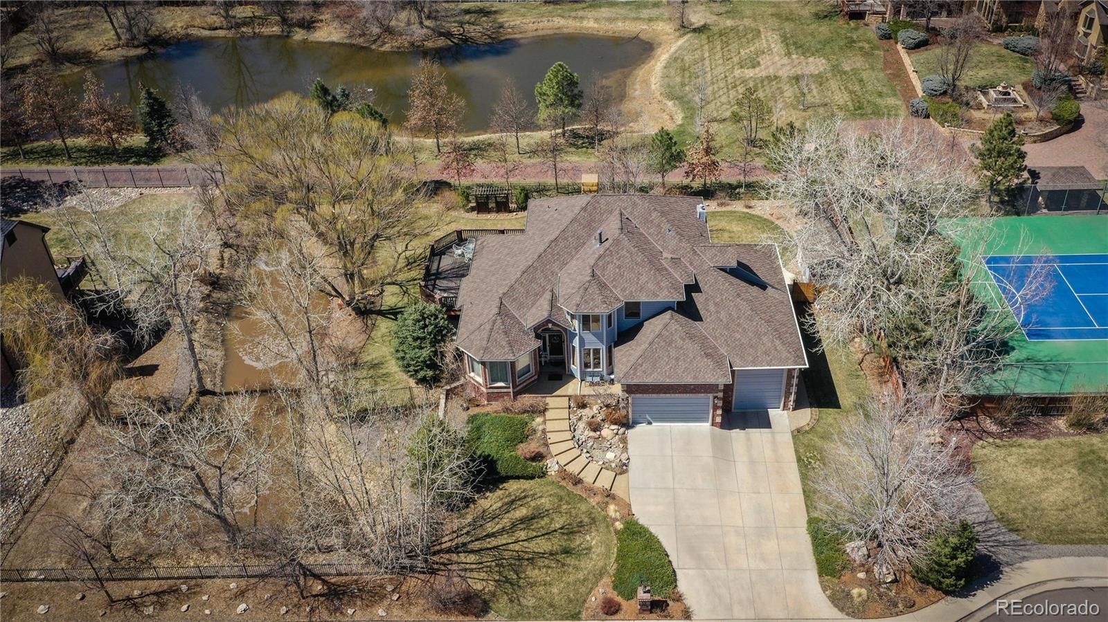 3935 Pierson Street Wheat Ridge, CO 80033 - Photo 37 of 40 a view of a house with a yard