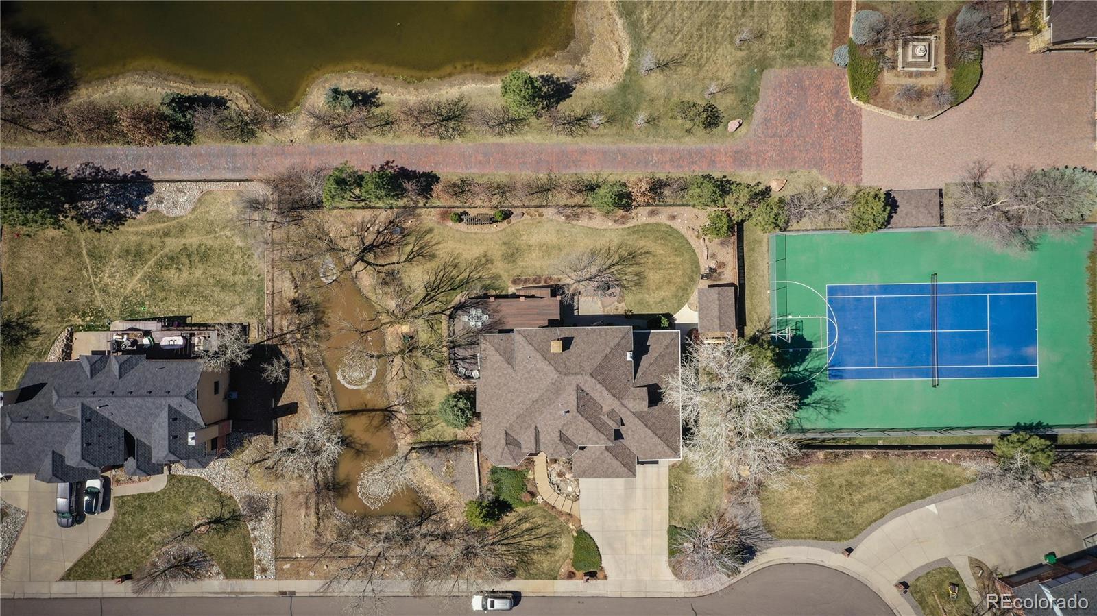 3935 Pierson Street Wheat Ridge, CO 80033 - Photo 38 of 40 an aerial view of a house with a yard