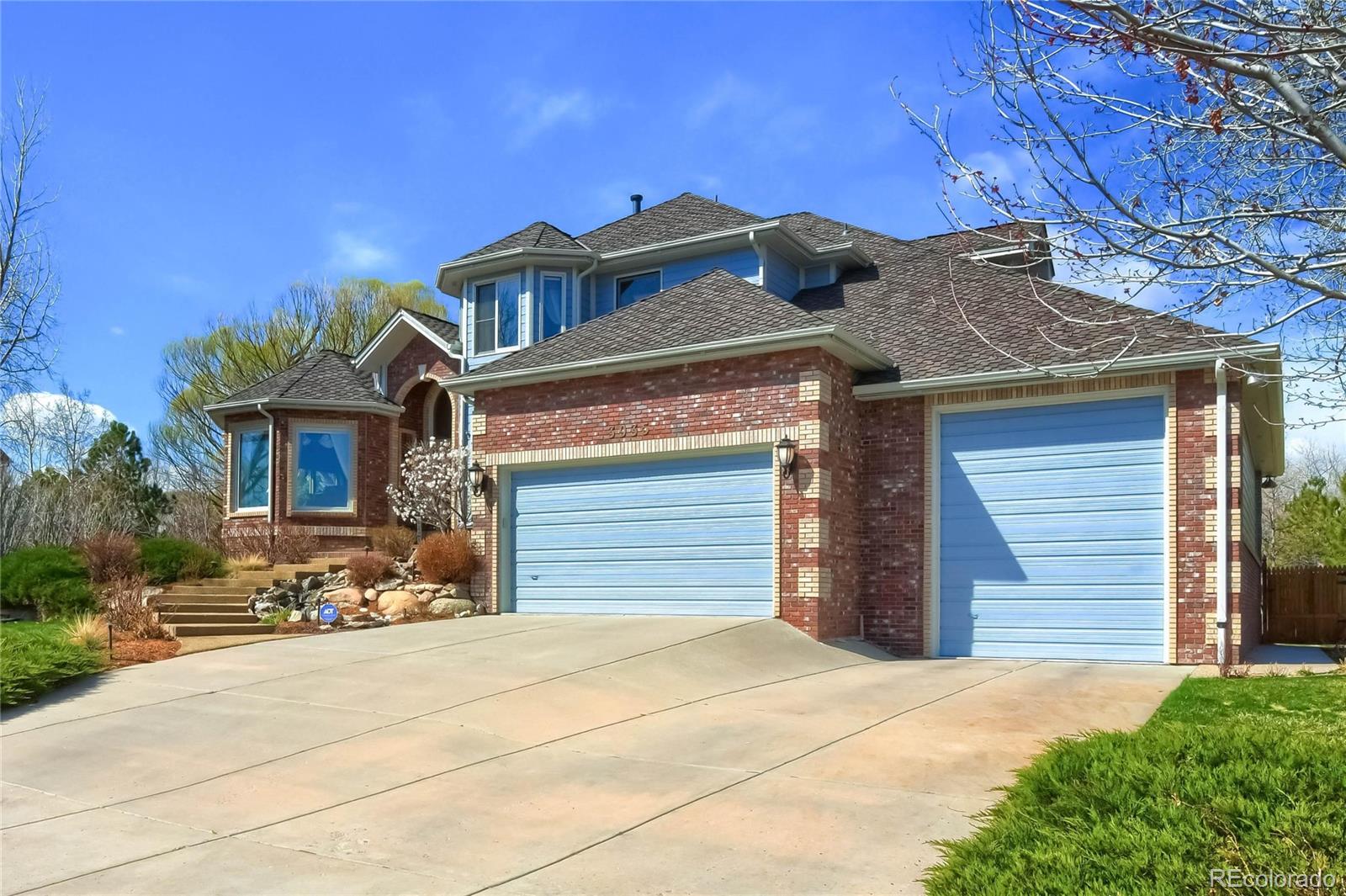 3935 Pierson Street Wheat Ridge, CO 80033 - Photo 40 of 40 a front view of a house with a yard