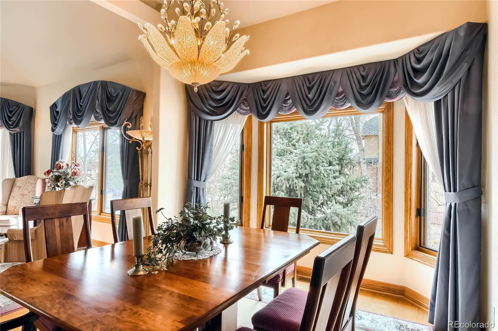 3935 Pierson Street Wheat Ridge, CO 80033 - Photo 6 of 40 a view of a dining room with furniture window and wooden floor