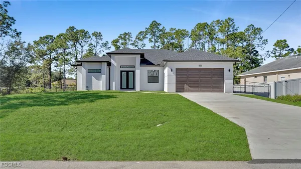 front view of a house with a yard