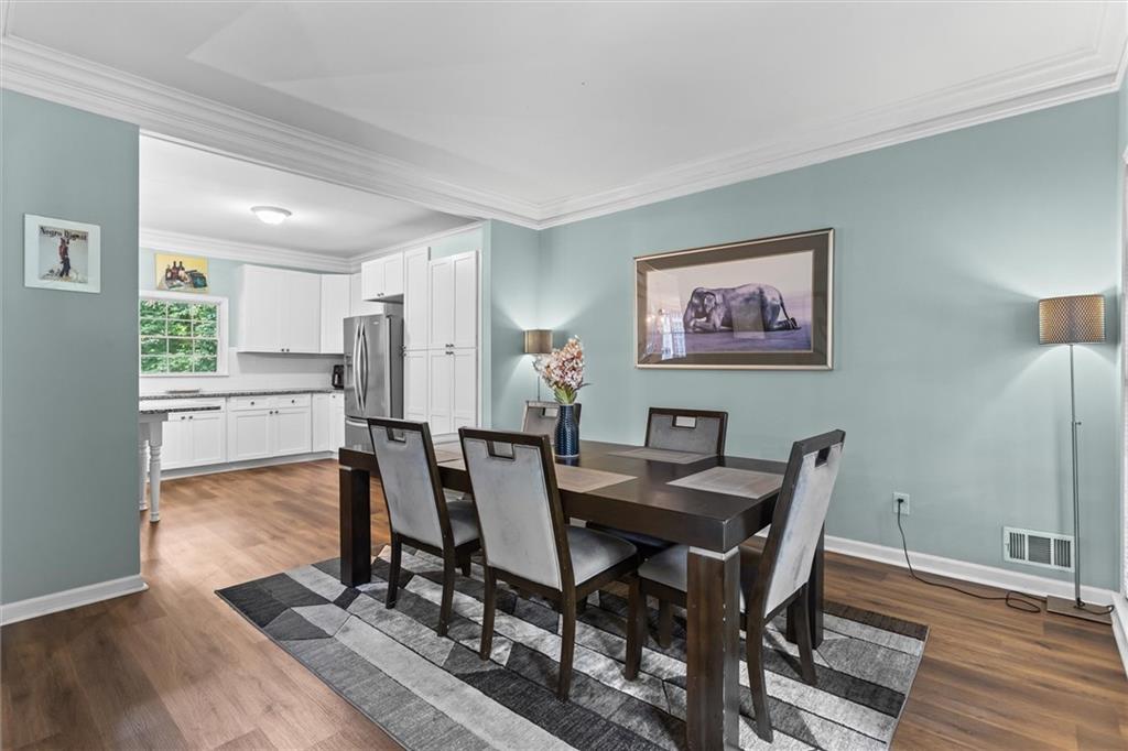 3183 Robinwood Trail Decatur, GA 30034 - Photo 13 of 61 a view of a dining room with furniture and wooden floor