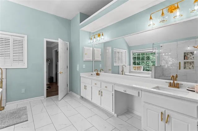 a bathroom with a shower and a sink