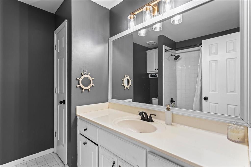 3183 Robinwood Trail Decatur, GA 30034 - Photo 38 of 61 a bathroom with a sink and a mirror
