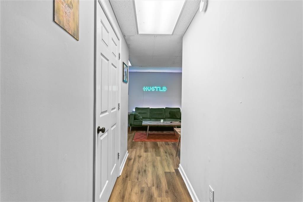 3183 Robinwood Trail Decatur, GA 30034 - Photo 53 of 61 a view of a hallway with wooden floor and staircase