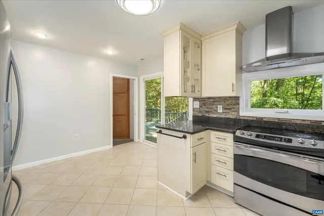 a kitchen with a stove a sink and a refrigerator