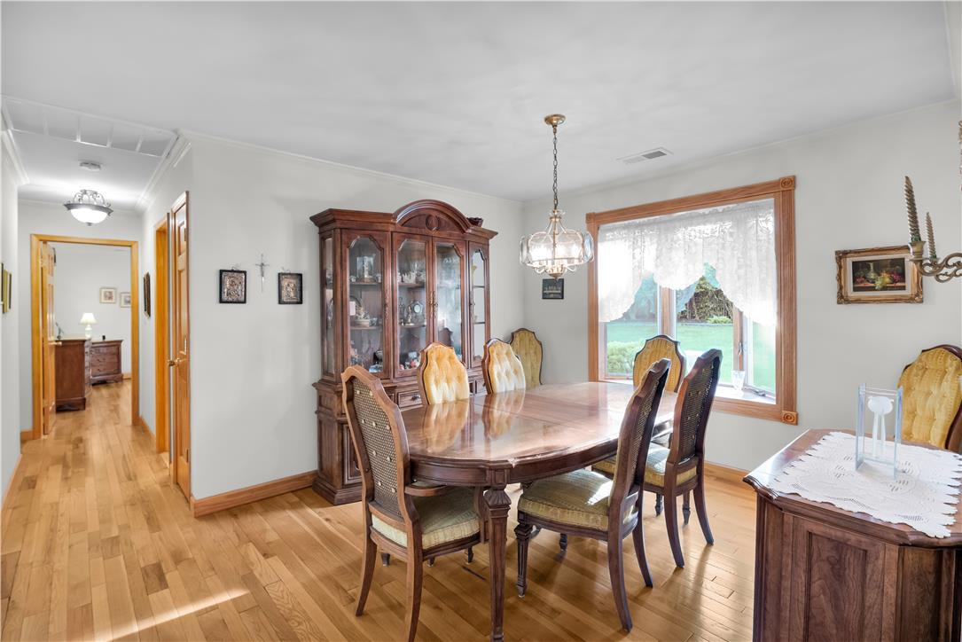 3915 Hecktown Road Bethlehem, PA 18020 - Photo 17 of 42 Rich hardwood floors and natural light from a wood-framed window define this welcoming space.